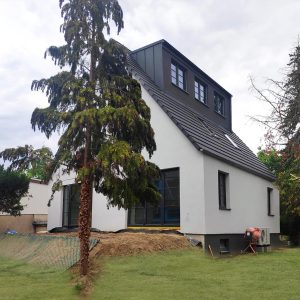 single-family house in Berlin with dormers, anthracite roof
